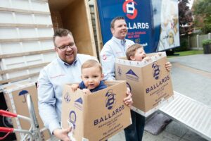 Joe and Matt Ballard with children in Ballards boxes