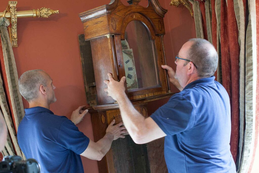 Ballards Removals staff taking care when moving fragile items during house move