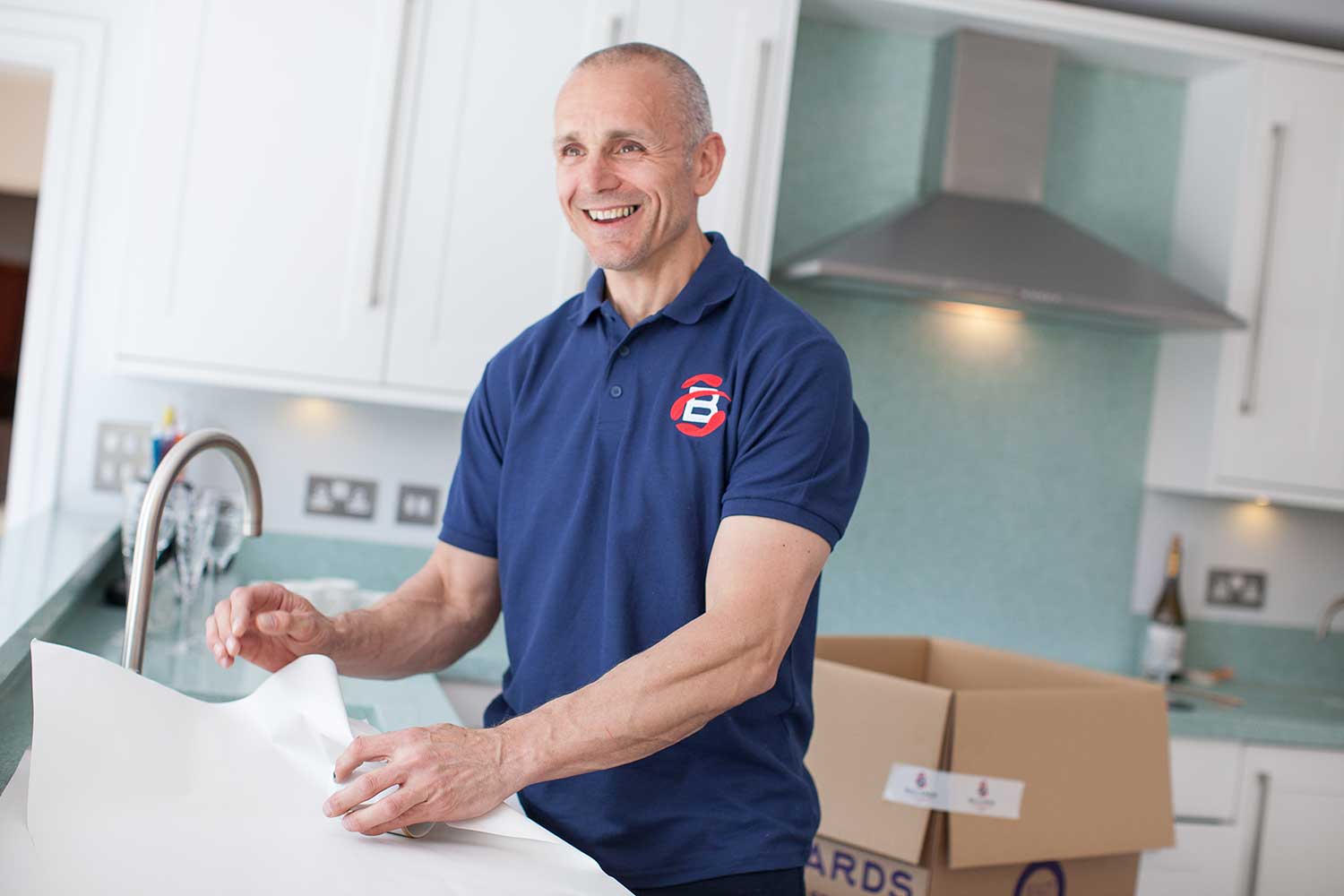 Ballards Removals staff packaging breakable items during a move