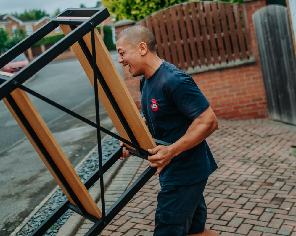 Ballards team member moving furniture