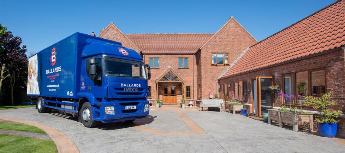 Ballards removals truck parked outside a property