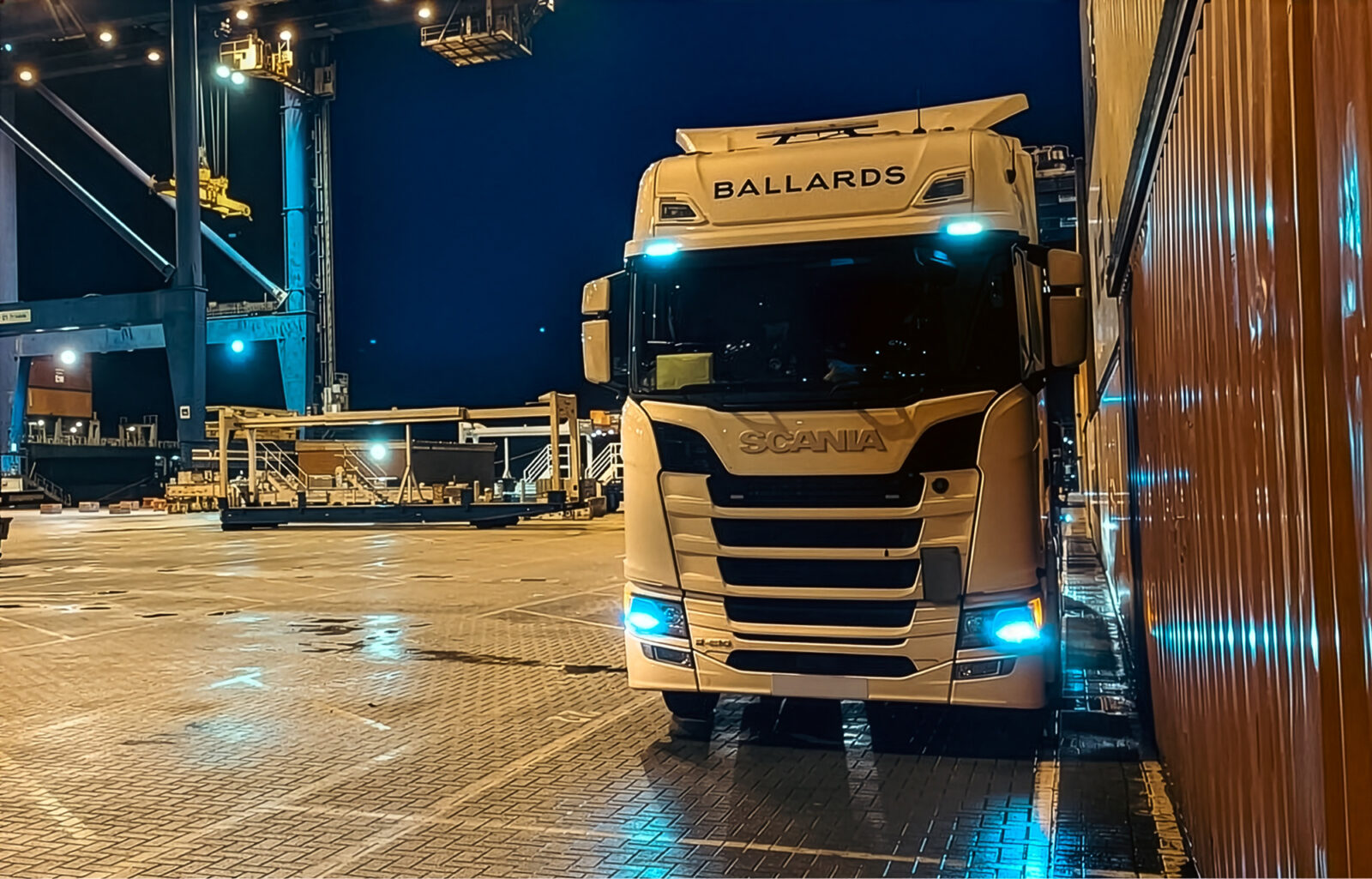Ballards removals lorry in a dockyard