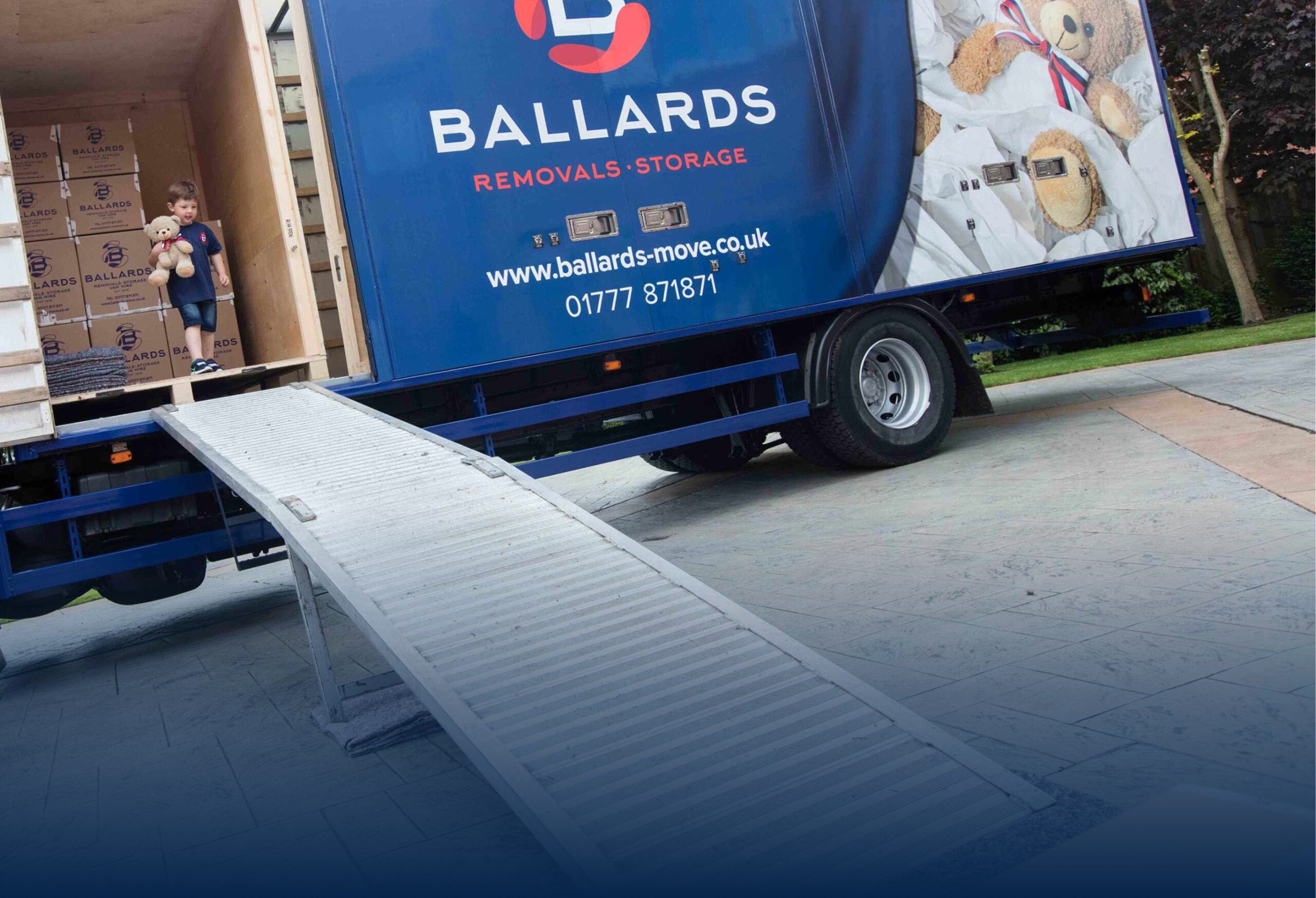 Ballards child carrying his teddy bear down the ramp of a removals truck.
