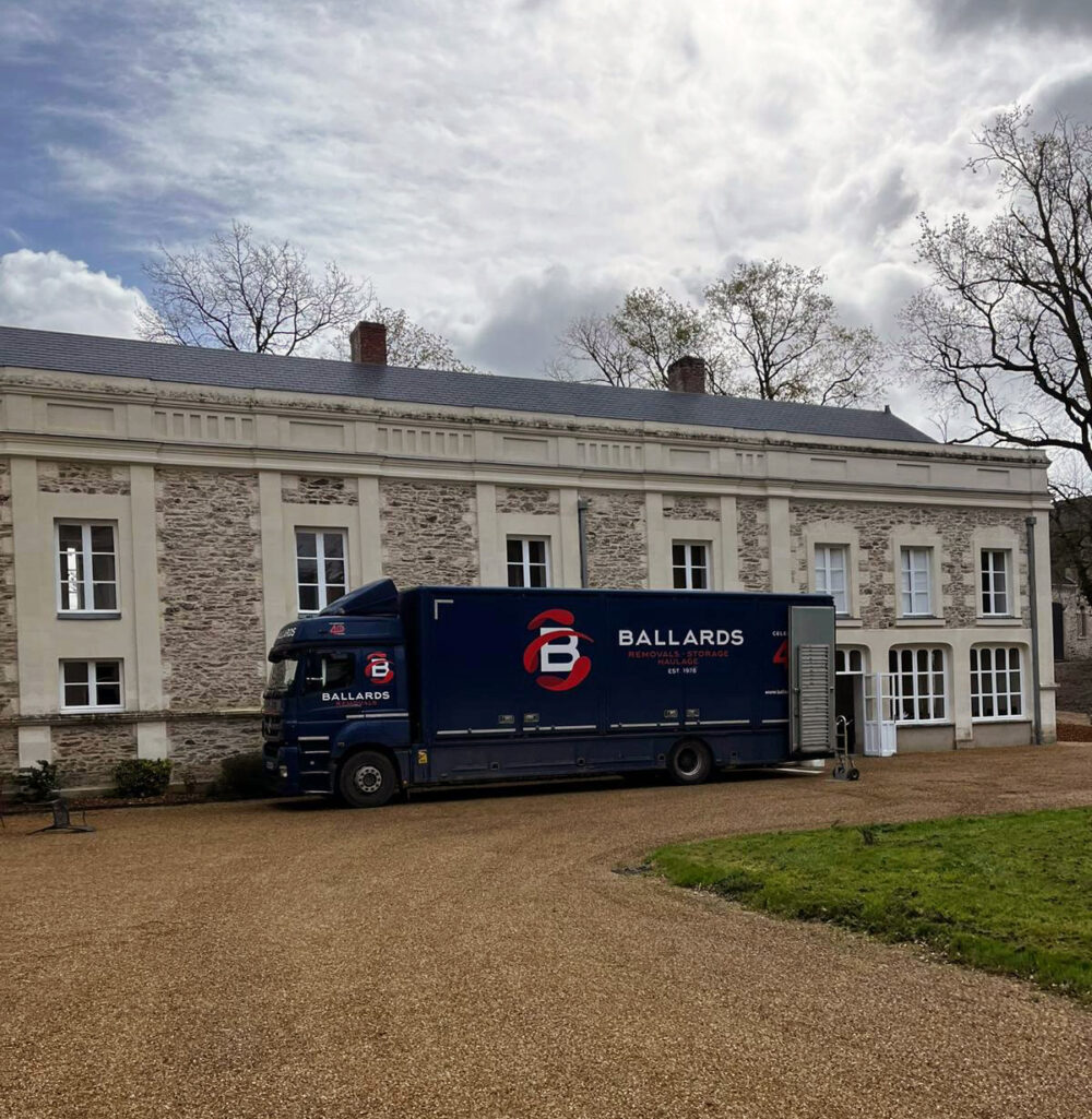 Ballards removals lorry outside a chateau in France