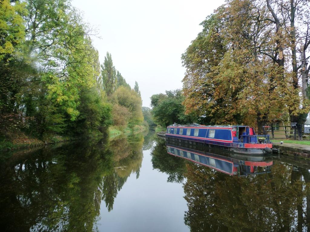 Barge in Ballards corporate colours on a stretch of chesterfield canal