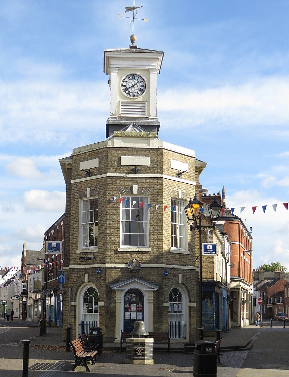 The front view of Brigg Town Hall, featuring its brick facade, arched windows, and decorative architectural detailing, captured from street level.
