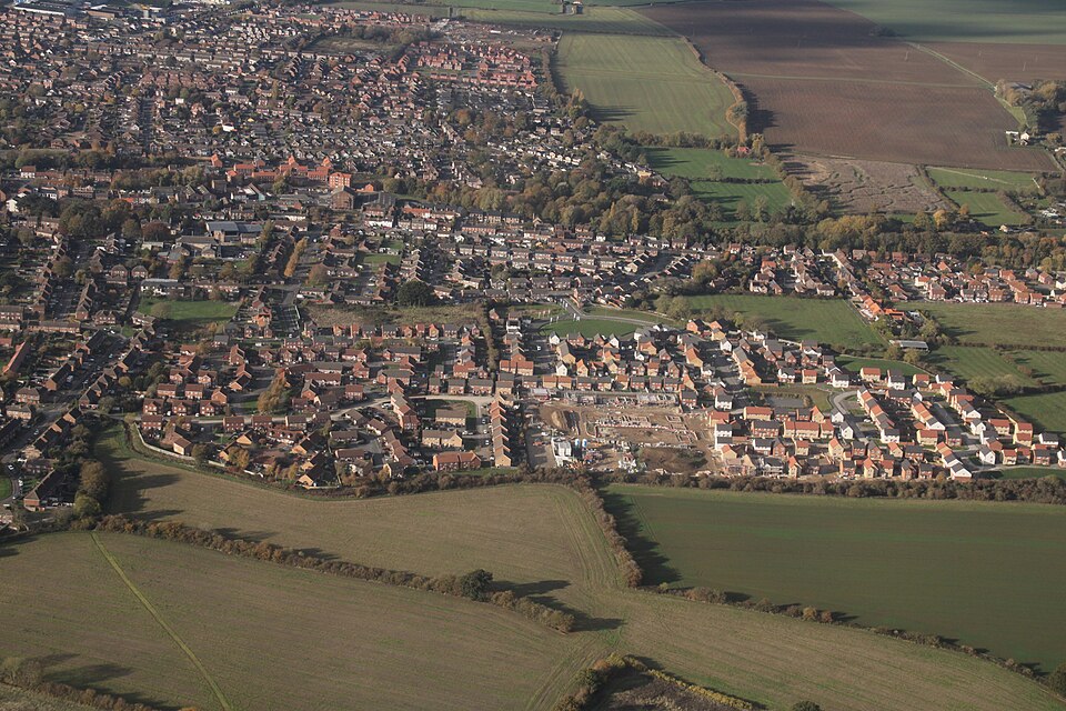 Aerial view of new housing on the east side of Louth, showing modern residential streets surrounded by open landscape.