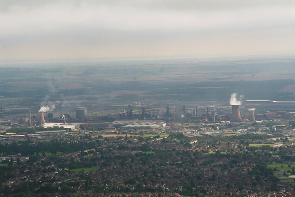 Aerial view of Scunthorpe showing the steel works complex, surrounding industrial buildings and nearby residential areas.